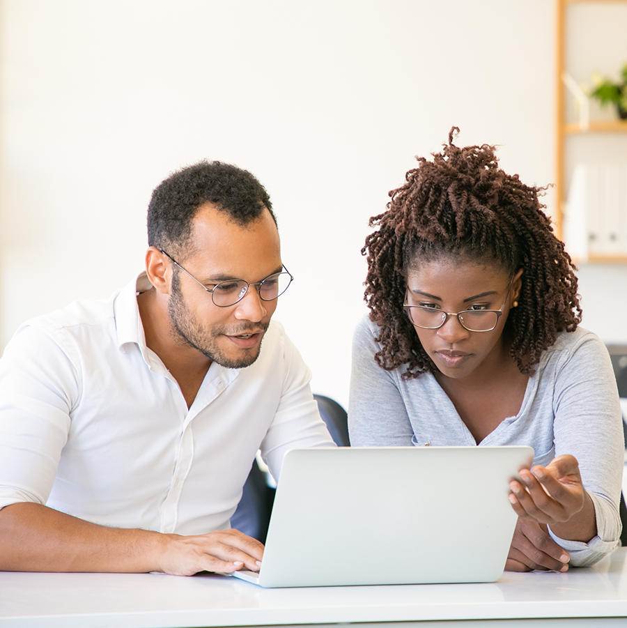 African American couple watching something on a laptop computer