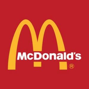 McDonald's golden arches logo in front of a red square
